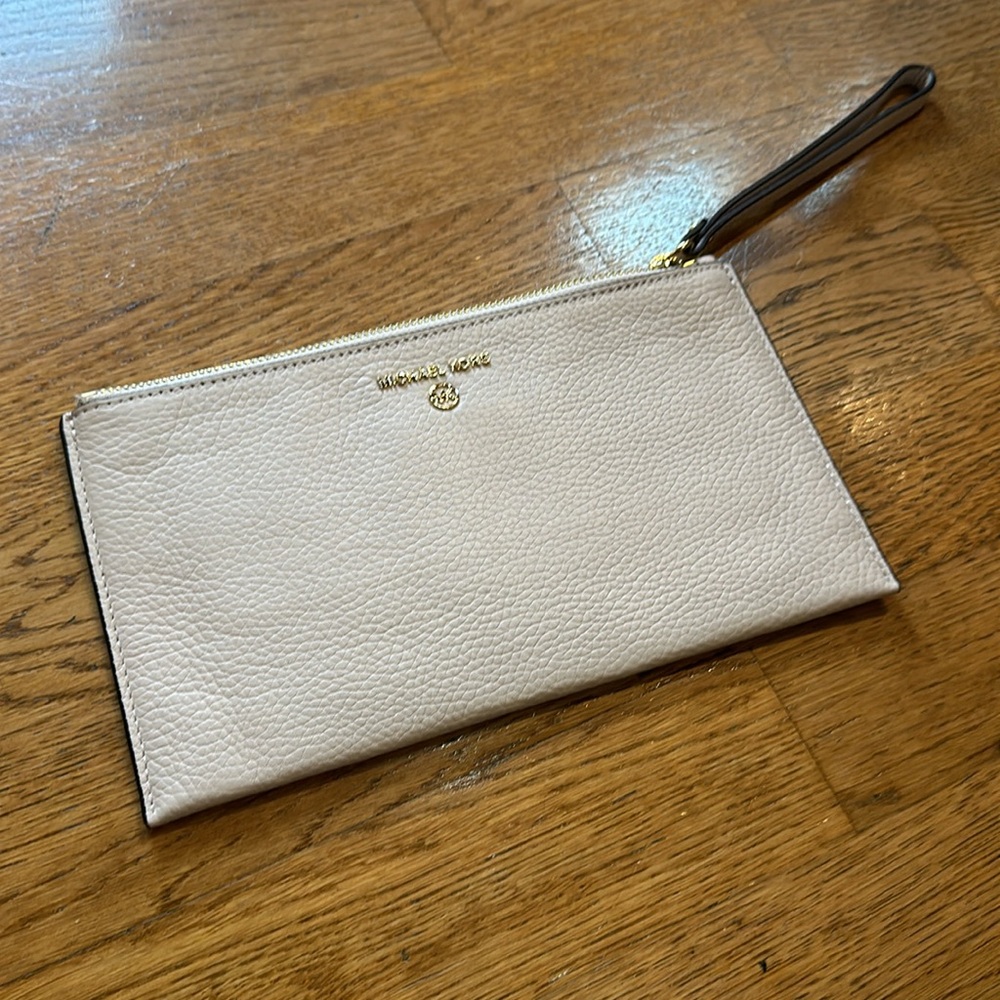 Michael Kors wristlet light pink/ nude with gold trim.  Clean, working zipper